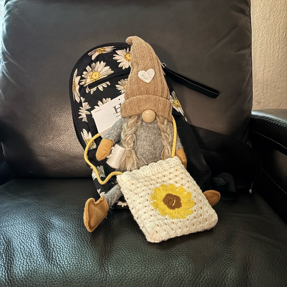 Daisy Print crossbody bag comes with gnome.